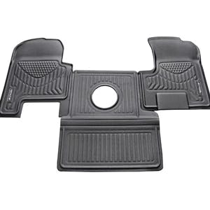 Custom-fit floor mats protecting a truck cabs interior from dirt and spills