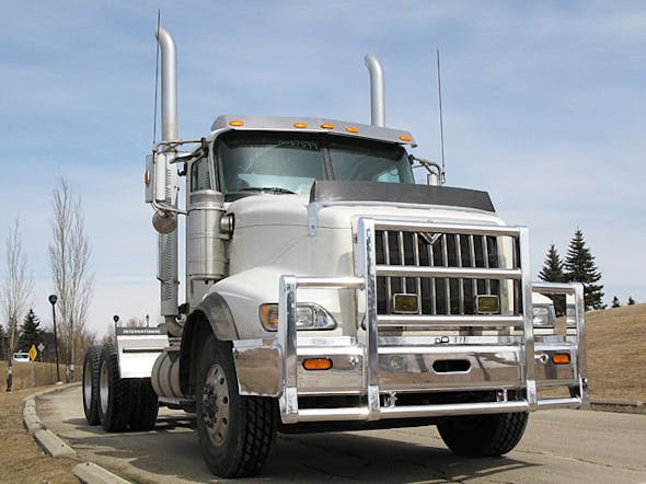 International 5900 SBA Herd 4 Post Defender Bumper Grill Guard With Horizontal Bars On Truck