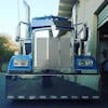 Kenworth W900L Stainless Steel Grill With Small Diamond Cutouts on Blue truck