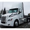 Freightliner Cascadia 2018+ Premium 304 Stainless Steel Bug Deflector - installed on truck, wider view