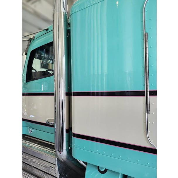 Peterbilt 589 64" Straight Pipe Stainless Steel Exhaust Heat Shield On Blue And White Truck Closeup Default Image